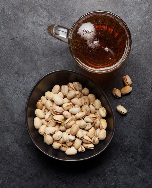 Draft beer and pistachio nuts