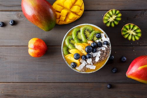 Peach smoothie bowl with kiwi fruit